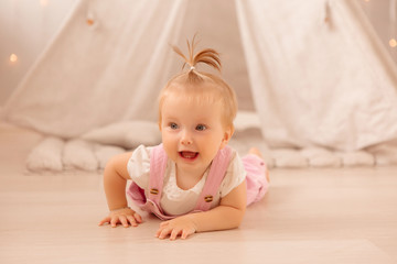 baby girl playing in the nursery, baby learning to walk, textiles for the nursery., tent in the children's room
