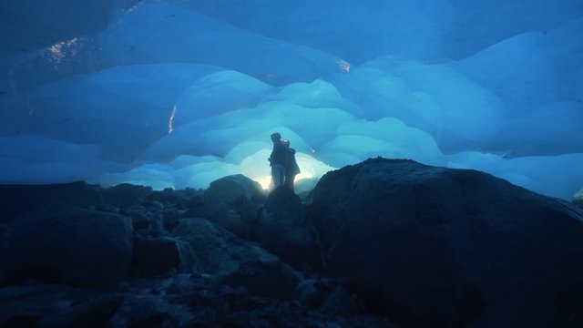 Forward: Water Flowing and People Exploring the Beautiful Cave of Mendenhall Glacier in Alaska