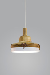 Suspended wooden lamp. Modern chandeliers of wood in Scandinavian style isolated on grey background