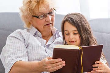 grandmother and granddaughter read