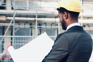 Construction worker and architect outside