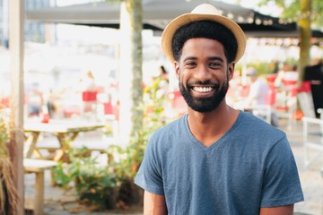 Beautiful happy man outside in the park