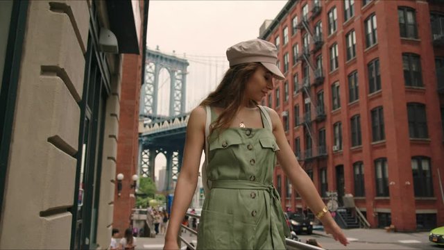 french tourist walks around Brooklyn and enjoying it, famous view on Manhattan Bridge, first time in New York, traveler's life.