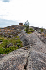 Fototapeta na wymiar Rocky island in the Baltic Sea, Finland. Landscape with huge stones and cracks in the granite massif. The environmentally friendly nature of Northern Europa Scandinavia.