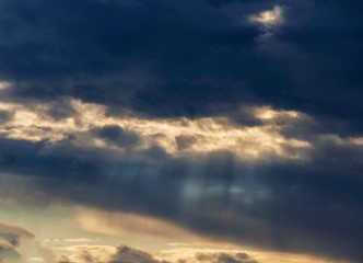 Dark dramatic sky with beautiful rays of light