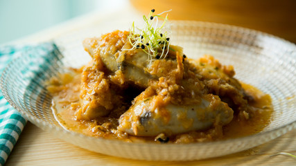 Squids with sauce. Restaurant dish.