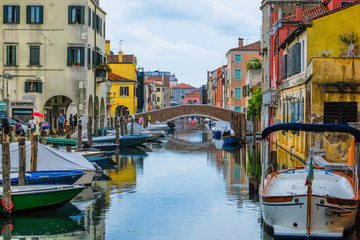 Fototapeta na wymiar Sottomarina, Italy - July, 07, 2019: cityscape with the image of channel in Sottomarina, Italy, the small town near Venice