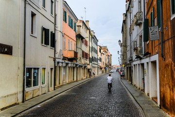 Naklejka na ściany i meble Sottomarina, Italy - July, 10, 2019: dwelling houses in a center of Sottomarina, Italy