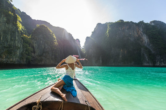 Beautiful woman on a long-tail boat in Thailand