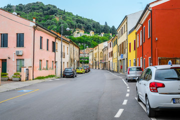 Fototapeta na wymiar Monselice, Italy - July, 7, 2019: cars parked on the street in Monselice, Italy