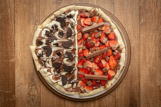 Sweet pizza with chocolate and strawberry. Top view.