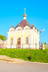 Fototapeta na wymiar Rybinsk, Russia - June, 10, 2019: small church on Volga embankment in Rybinsk, Russia
