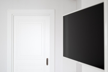 copy space white interior with door wall and tv in classic modern interior
