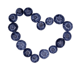 cotout heart mark made from blueberries on a white background isolated
