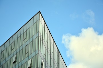 Fototapeta na wymiar modern building with blue sky and clouds