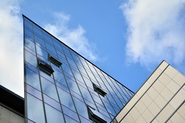 Fototapeta na wymiar modern building with blue sky and clouds