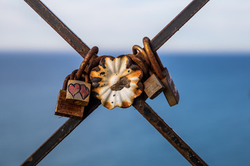 Locks of love on a rusty fence