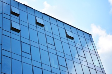 modern building with blue sky and clouds