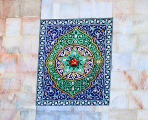 Beautiful pattern with flowers and coat of arms of the USSR on the wall