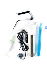 Sous vide stick or rooner close up, top view of a modern utensil for the sous vide cooking technique, ooner,  precision immersion circulator. Isolated on clean background. 