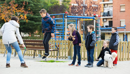 Children playing skipping rope
