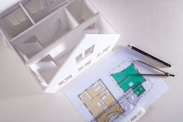 The workplace of the architect. The layout of the house is made on the basis of drawings. The layout of the interior of the cottage. Development of the concept of a new home.