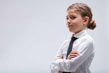 Young girl looking speculatively at the camera
