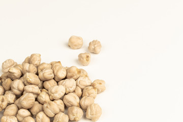 Dry raw organic chickpeas isolated on white background.
