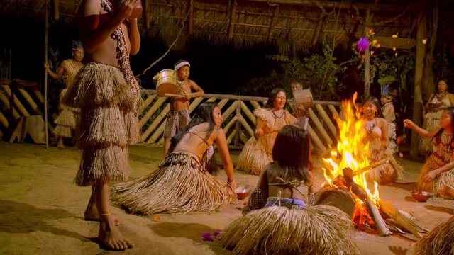 Traditional Indigenous Ceremony In The Jungle By Night Around The Fire In Ecuador