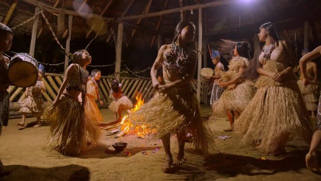 Traditional Indigenous Ceremony In The Jungle By Night Around The Fire In Ecuador