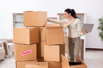 Young woman moving to new flat