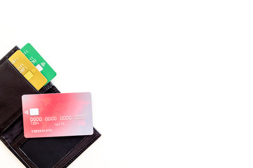 Bank card, debit, credit in wallet on white background top view copyspace