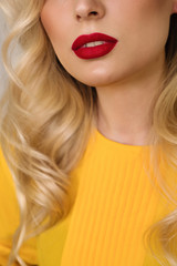 Sexy Red Lips. Beauty fashion. Lip make up - matte Red lipstick. Medium length wave blonde hair....