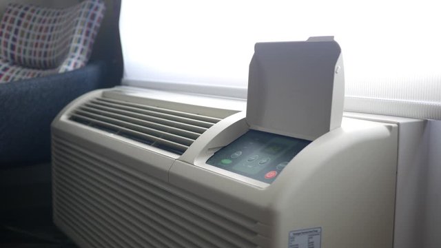 An air conditioning unit in a hotel room