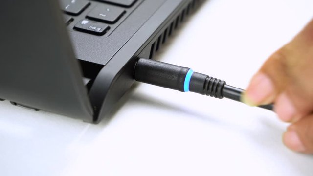 plug power cable from laptop Close up