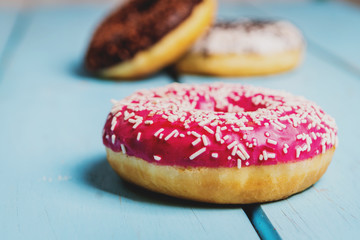 Sweet donuts on black stone table