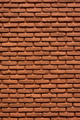 brown brick wall that is old and cracked