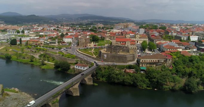Aerial: The Palace, Church, and Bridge of Barcelos on the Cavado River with Backdrop of Barcelos City - Barcelos, Portugal
