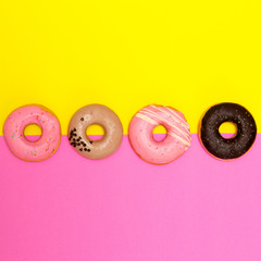 Donuts set  on a colored background. Flat lay fast food art