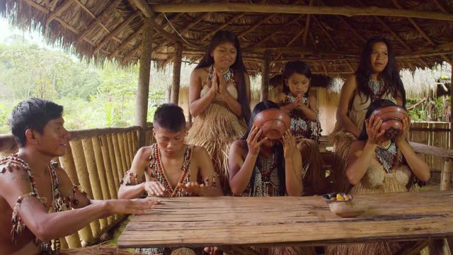Amazonian Indigenous People Competing In Drinking Chicha In Ecuador