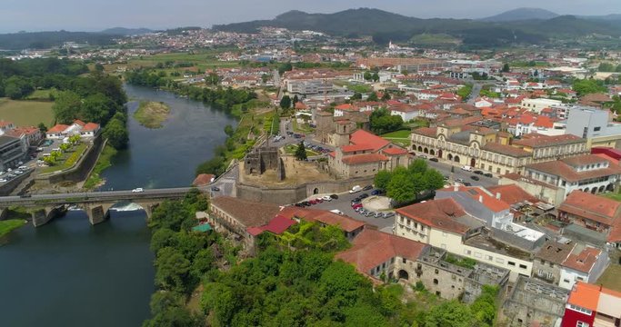 Aerial Pan: Downtown Barcelos with Numerous Famous Landmarks, Cavado River, and Backdrop of City and Rolling Hills - Barcelos, Portugal