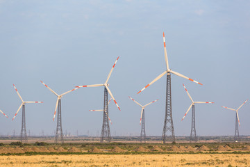 Wind generators in the background in Azerbaijan. Nature ecology concept.