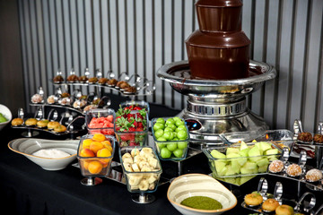 dessert candy open bar stand full with delicious desserts candies and fruits