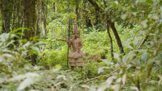 Indigenous Warrior Running Through The Amazon Rainforest In Ecuador