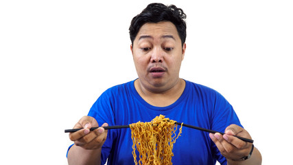 fat or overweight Asian man eat a lot of instant noodles or pasta with chopsticks isolated