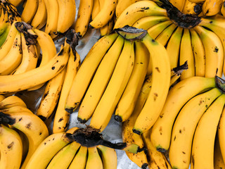 bunch of bananas on the market shelf