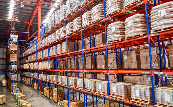 Package of products on the shelf inside distribution warehouse. Product logistics concept
