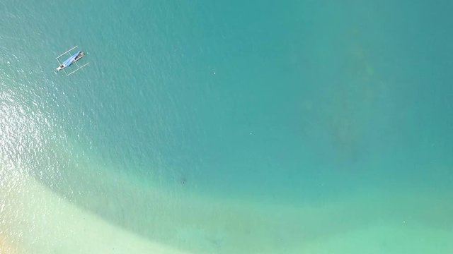 Top view of a boat in the blue sea. Beautiful natural seascape at the summer time