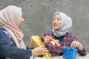 portrait of two hijab woman best friend having time together in celebrate an event