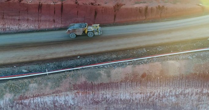 Side view of truck entering mine pit